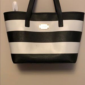 Michael Kors black and white striped handbag.